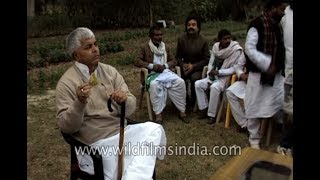 Lalu Prasad Yadav chews paan or betel leaf at a political meeting [upl. by Hakon]